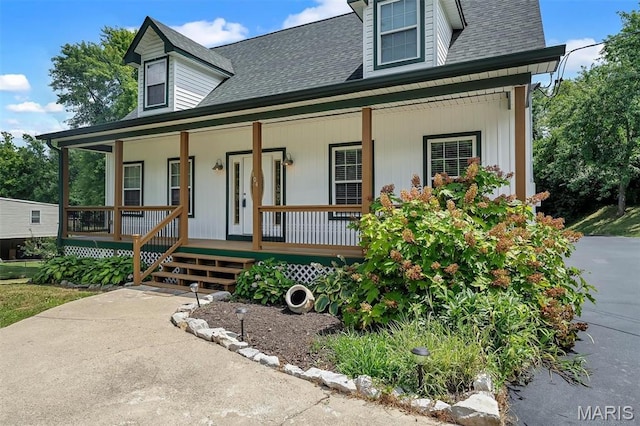 104 Miller Dr, Fenton, MO 63026 - view of front facade with a porch and a shingled roof