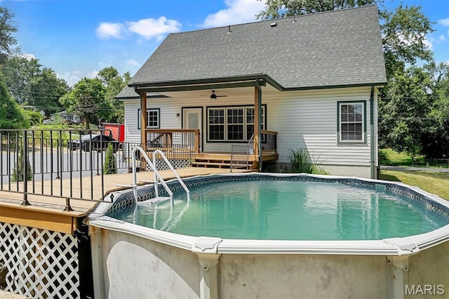 104 Miller Dr, Fenton, MO 63026 - swimming pool featuring a wooden deck and a ceiling fan
