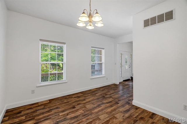 104 Miller Dr, Fenton, MO 63026 - spare room featuring a chandelier and dark wood-type flooring