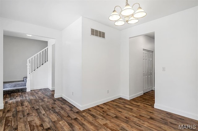 104 Miller Dr, Fenton, MO 63026 - unfurnished room with a chandelier, stairs, and wood finished floors