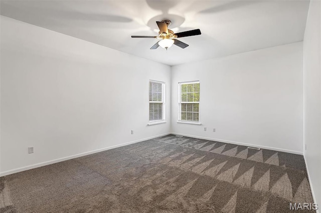 104 Miller Dr, Fenton, MO 63026 - spare room with a ceiling fan and dark colored carpet