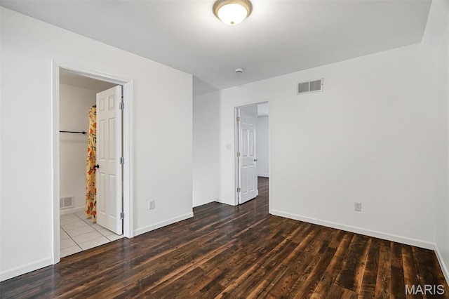 104 Miller Dr, Fenton, MO 63026 - unfurnished bedroom with wood finished floors and baseboards