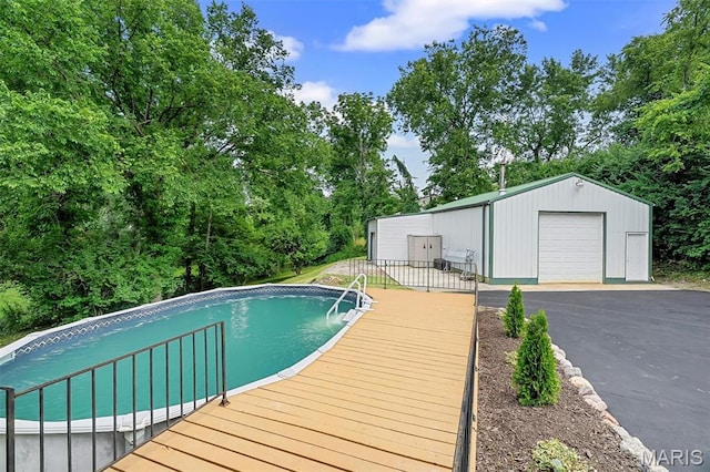104 Miller Dr, Fenton, MO 63026 - swimming pool featuring an outdoor structure and view of wooded area
