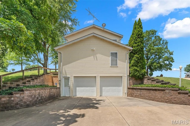 4840 S Point Rd, Washington, MO 63090 - view of side of property featuring stairway, a garage, and driveway