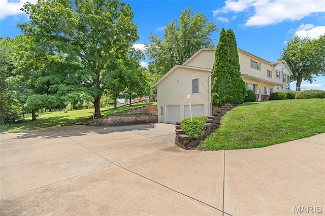 4840 S Point Rd, Washington, MO 63090 - view of property exterior featuring a garage, concrete driveway, and a lawn