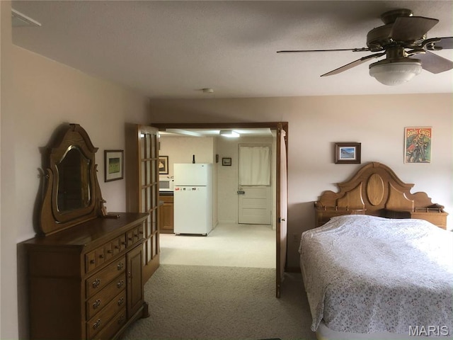 4840 S Point Rd, Washington, MO 63090 - bedroom with freestanding refrigerator, light colored carpet, and a ceiling fan