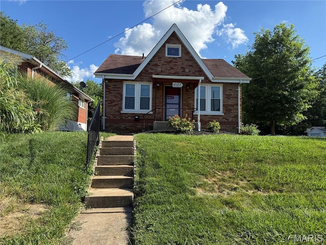 10122 Niblic Dr, Saint Louis, MO 63114 - bungalow-style home featuring brick siding and a front lawn