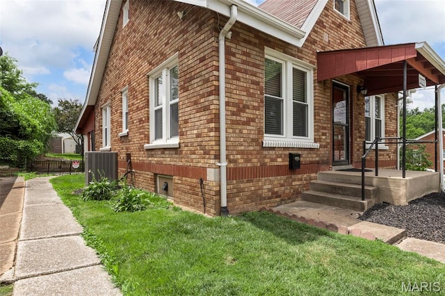 10122 Niblic Dr, Saint Louis, MO 63114 - view of side of home featuring brick siding and a central air condition unit