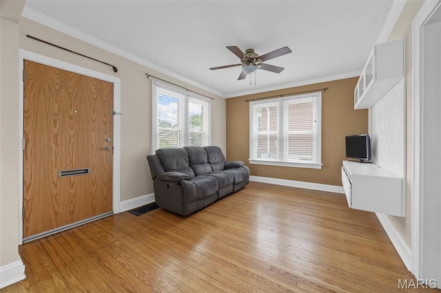 10122 Niblic Dr, Saint Louis, MO 63114 - living room with light wood-style flooring, crown molding, and a ceiling fan