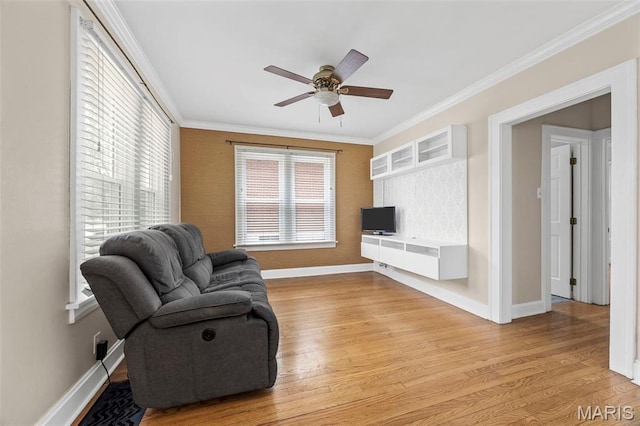 10122 Niblic Dr, Saint Louis, MO 63114 - living room featuring ornamental molding, light wood-style floors, and a ceiling fan