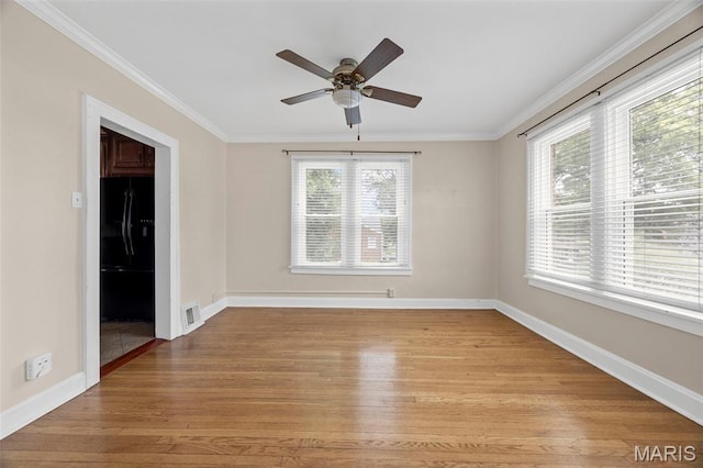 10122 Niblic Dr, Saint Louis, MO 63114 - empty room featuring light wood finished floors, a ceiling fan, and ornamental molding
