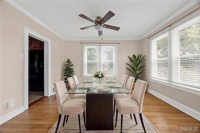 10122 Niblic Dr, Saint Louis, MO 63114 - dining room featuring light wood finished floors, ornamental molding, and ceiling fan