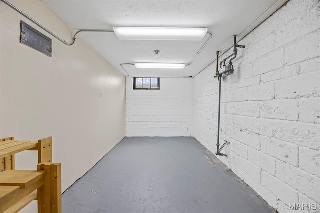 10122 Niblic Dr, Saint Louis, MO 63114 - basement featuring concrete block wall
