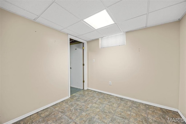 10122 Niblic Dr, Saint Louis, MO 63114 - finished basement featuring a paneled ceiling and stone finish floors