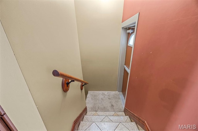 10122 Niblic Dr, Saint Louis, MO 63114 - stairs featuring baseboards