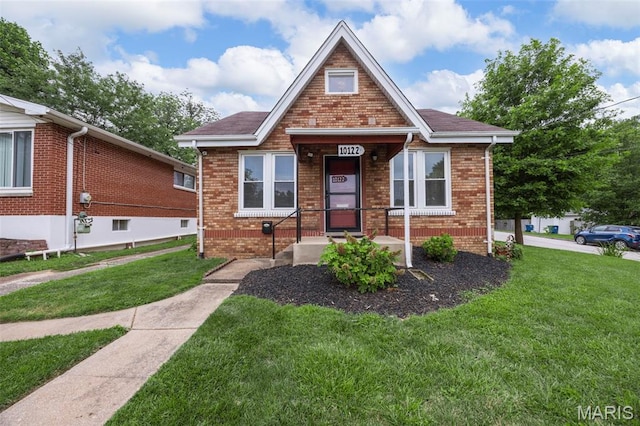 10122 Niblic Dr, Saint Louis, MO 63114 - bungalow-style home with a front lawn and brick siding