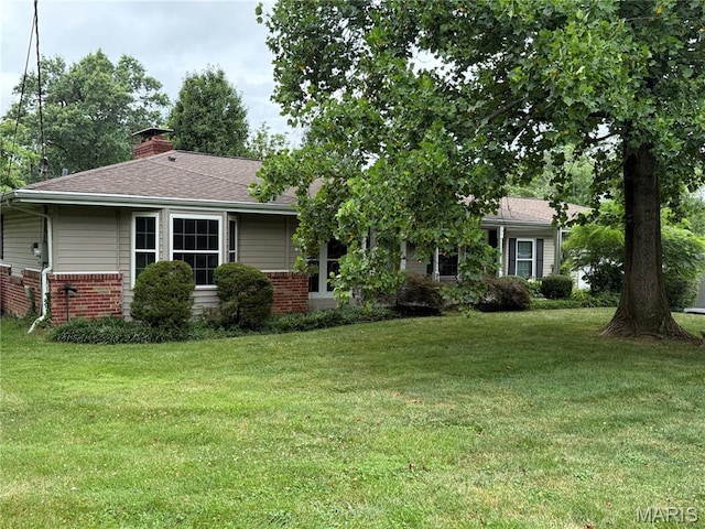9457 Chavez Dr, Sunset Hills, MO 63127 - view of front of property featuring brick siding, a chimney, and a front lawn