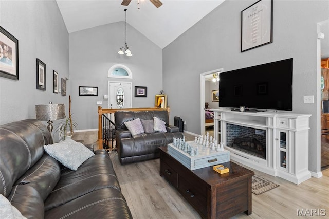 441 Rue Martel, Bonne Terre, MO 63628 - living room with a ceiling fan, light wood finished floors, high vaulted ceiling, and a fireplace