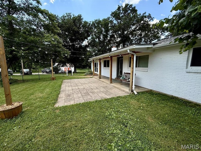 10107 Cannon Mines Rd, Cadet, MO 63630 - view of green lawn featuring a patio