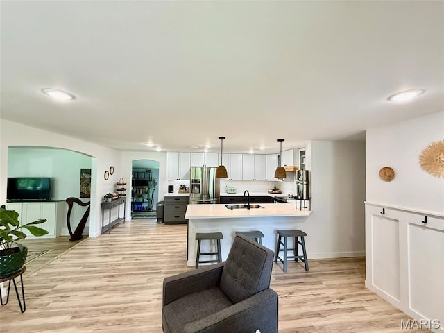 10107 Cannon Mines Rd, Cadet, MO 63630 - living area with arched walkways and light wood-style floors