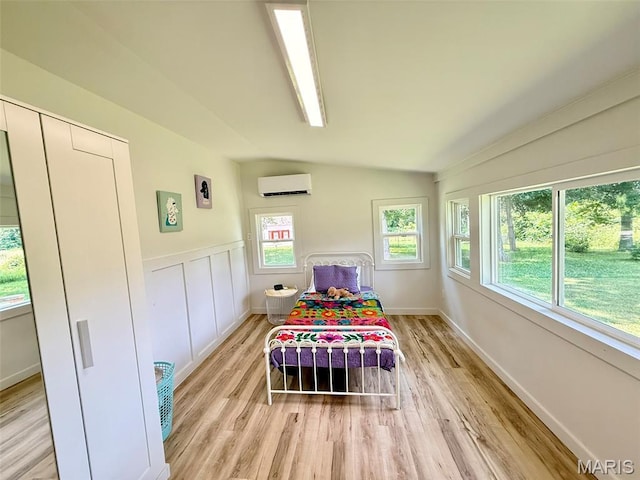 10107 Cannon Mines Rd, Cadet, MO 63630 - bedroom with an AC wall unit and light wood-style flooring