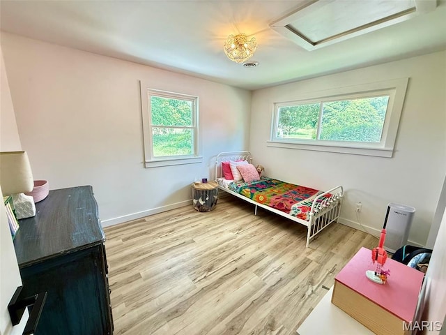 10107 Cannon Mines Rd, Cadet, MO 63630 - bedroom featuring attic access and wood finished floors