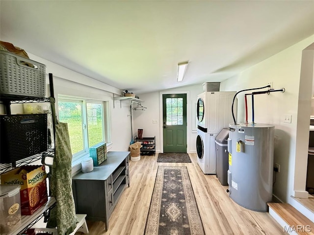 10107 Cannon Mines Rd, Cadet, MO 63630 - washroom featuring electric water heater, stacked washing machine and dryer, and light wood-style flooring