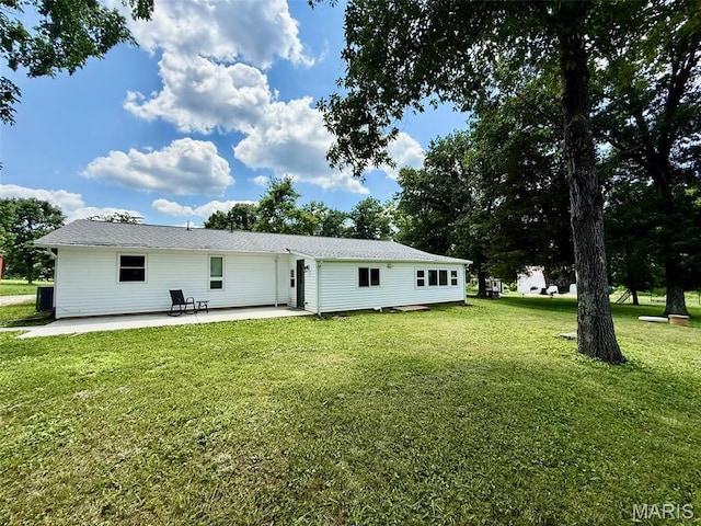 10107 Cannon Mines Rd, Cadet, MO 63630 - back of property with a patio area and a yard