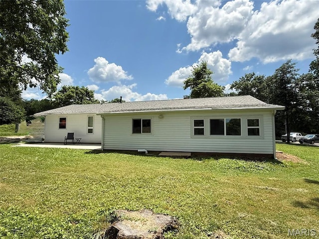 10107 Cannon Mines Rd, Cadet, MO 63630 - back of house featuring a patio, a yard, and a shingled roof