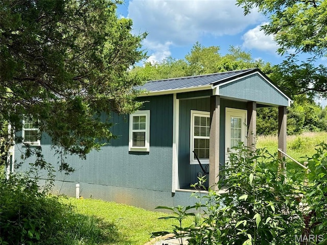 10107 Cannon Mines Rd, Cadet, MO 63630 - view of side of property featuring a metal roof, a standing seam roof, and an outdoor structure