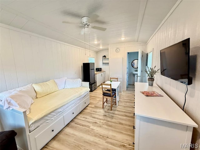 10107 Cannon Mines Rd, Cadet, MO 63630 - living area with light wood-style floors, a ceiling fan, and wood walls