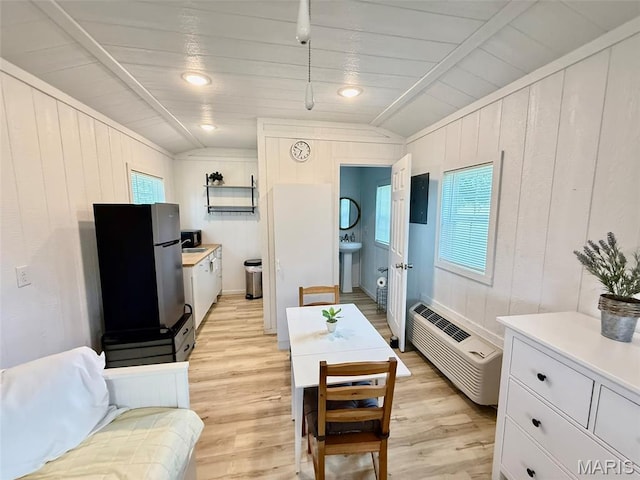 10107 Cannon Mines Rd, Cadet, MO 63630 - living room featuring light wood-type flooring, wood ceiling, wooden walls, and vaulted ceiling