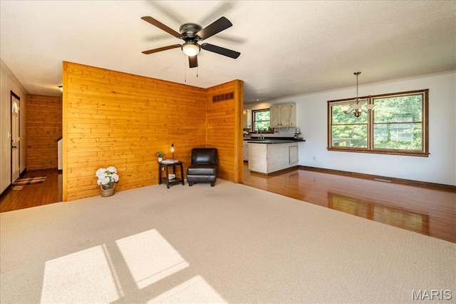 25 Whispering Oaks Dr, Washington, MO 63090 - unfurnished room featuring carpet floors, wooden walls, and ceiling fan