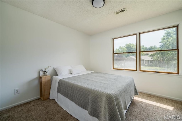 25 Whispering Oaks Dr, Washington, MO 63090 - carpeted bedroom featuring baseboards and a textured ceiling