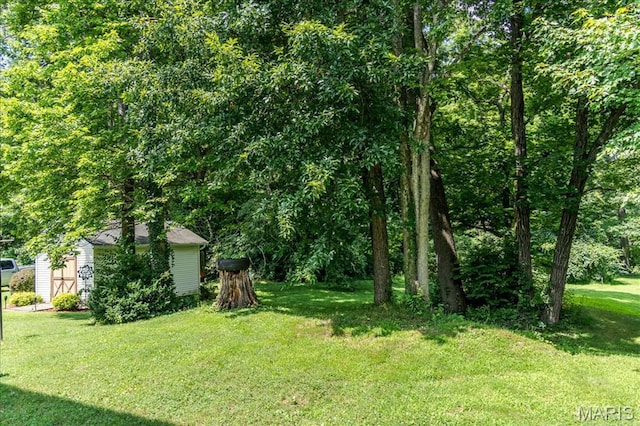 25 Whispering Oaks Dr, Washington, MO 63090 - view of grassy yard featuring a storage unit