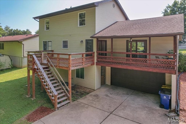 25 Whispering Oaks Dr, Washington, MO 63090 - rear view of house with a garage, a yard, stairway, driveway, and a shingled roof