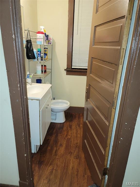 4833 Penrose St, Saint Louis, MO 63115 - half bath with vanity and wood finished floors