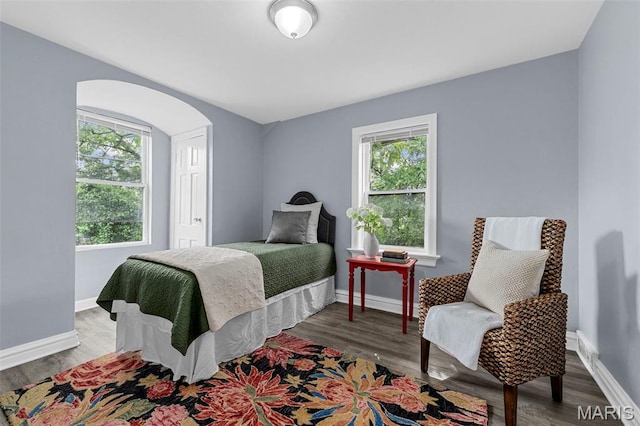 6629 Barken Ave, Northwoods, MO 63121 - bedroom with wood finished floors and arched walkways