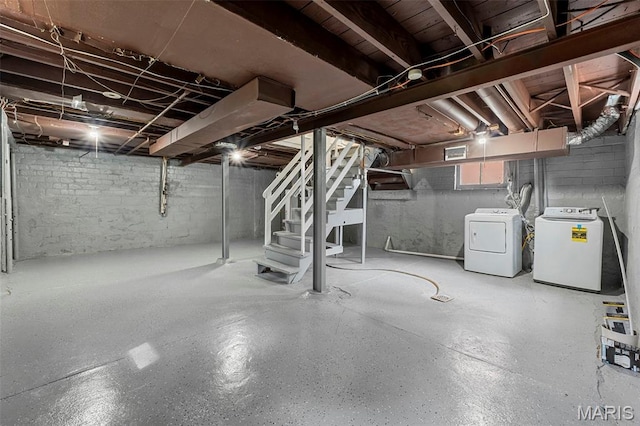 6629 Barken Ave, Northwoods, MO 63121 - below grade area featuring washing machine and clothes dryer and stairway
