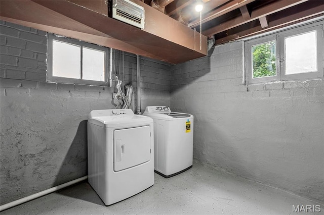 6629 Barken Ave, Northwoods, MO 63121 - laundry area featuring washing machine and clothes dryer