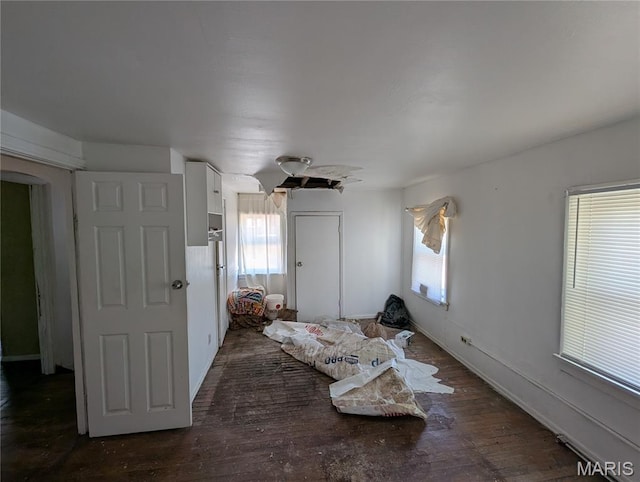 4320 Edgewood Blvd, Saint Louis, MO 63121 - bedroom featuring multiple windows, wood finished floors, arched walkways, and ceiling fan