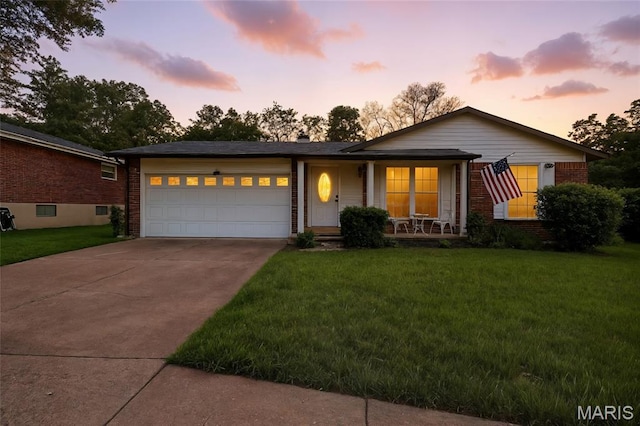 5621 Chalet Manor Ct, Saint Louis, MO 63129 - single story home featuring concrete driveway, covered porch, brick siding, and a front yard