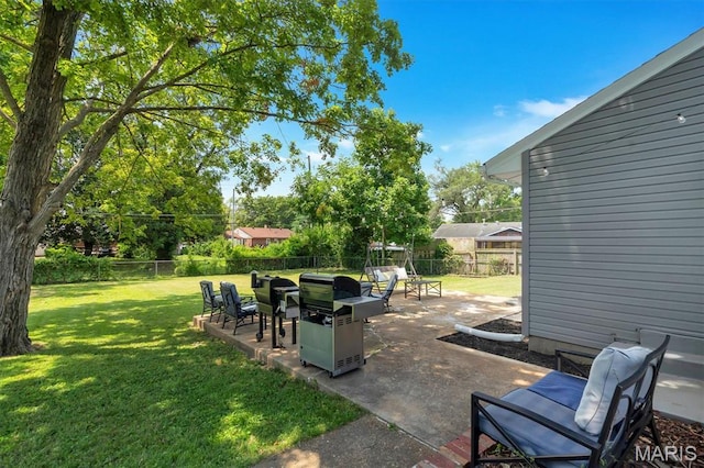 962 Buckeye Dr, Ferguson, MO 63135 - fenced backyard featuring a patio area and a grill