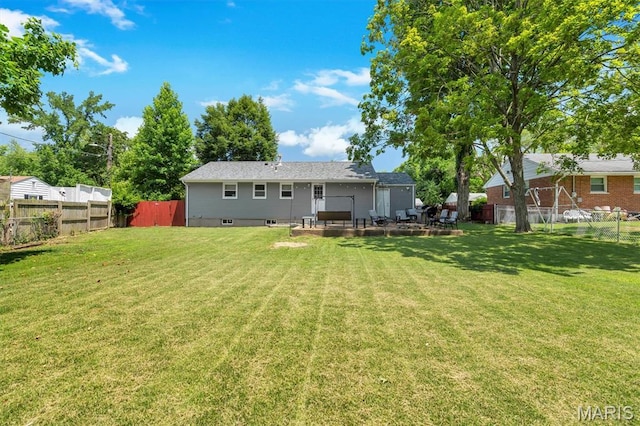 962 Buckeye Dr, Ferguson, MO 63135 - rear view of property with a fenced backyard