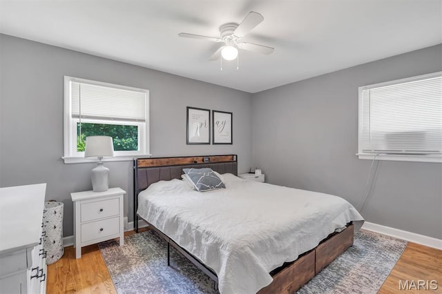 962 Buckeye Dr, Ferguson, MO 63135 - bedroom with light wood-style floors and ceiling fan