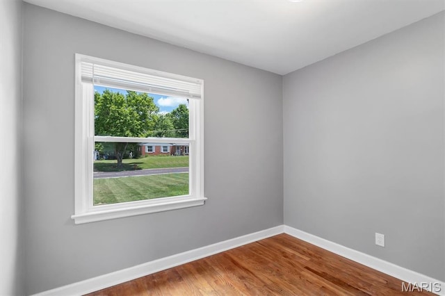 962 Buckeye Dr, Ferguson, MO 63135 - spare room with baseboards and wood finished floors