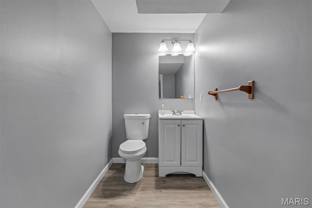 962 Buckeye Dr, Ferguson, MO 63135 - half bathroom with vanity and wood finished floors