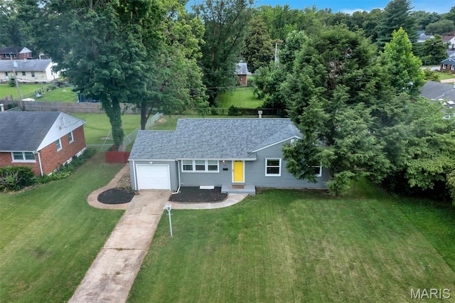 962 Buckeye Dr, Ferguson, MO 63135 - view of front of home featuring driveway, an attached garage, and a shingled roof