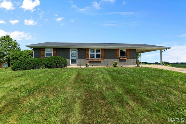 1658 County Road 435, Jackson, MO 63755 - ranch-style house with brick siding, an attached carport, concrete driveway, and a front lawn