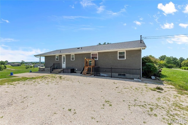 1658 County Road 435, Jackson, MO 63755 - rear view of house with a patio and brick siding